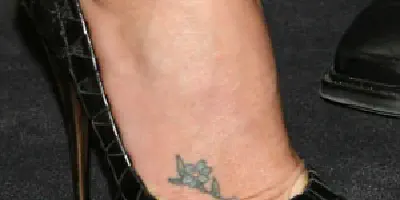 Charlize Theron Arm Tattoo