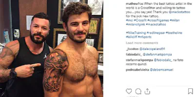Mat Fraser's linker Tattoo am Arm